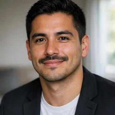 Young Latino man, mustache, short black hair, calm expression, dark blazer